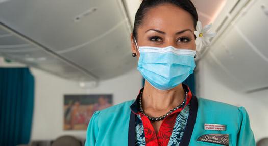 Air Tahiti Nui airhostess with mask