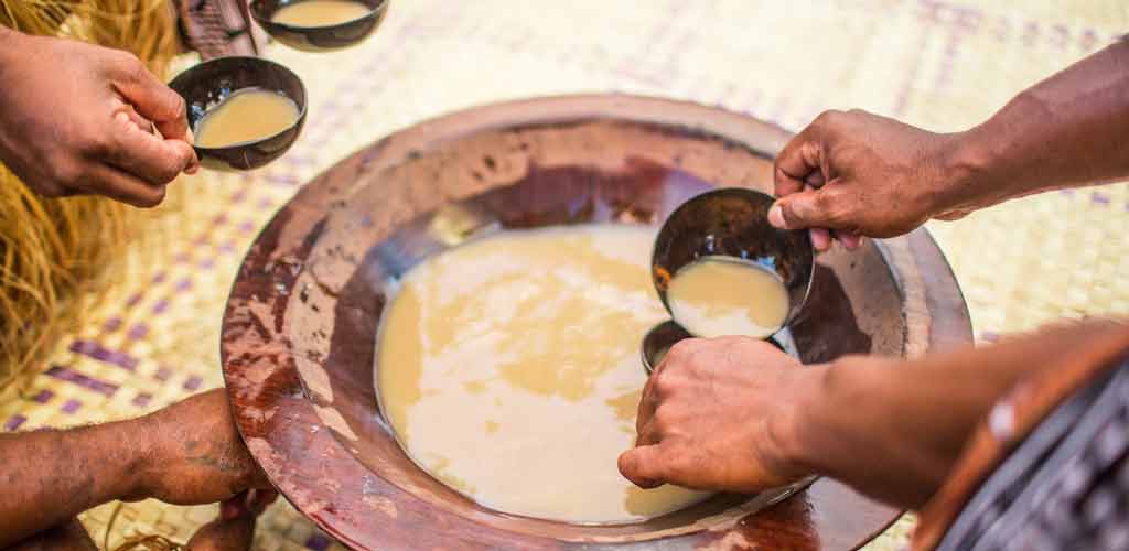 Kava bring made in the traditional wooden mixing bowl at the Lomani Island Resort, Fiji.