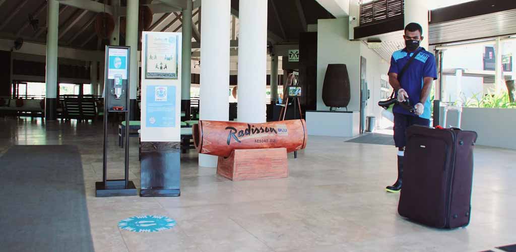 Radisson Blu Resort Fiji staff disinfecting the reception area