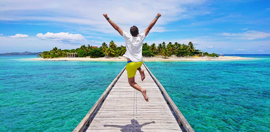 Fiji man jumping on jetty