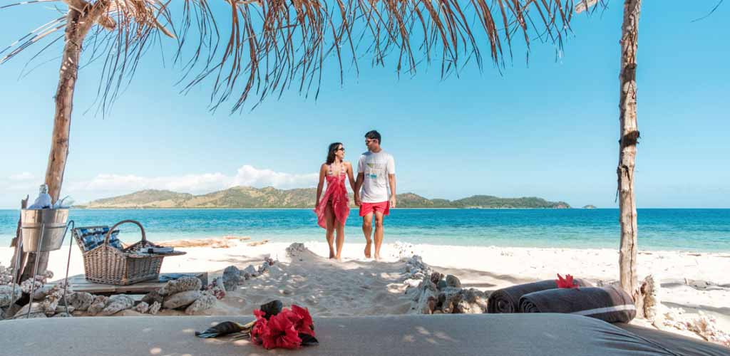 A couple on a beach in Fiji