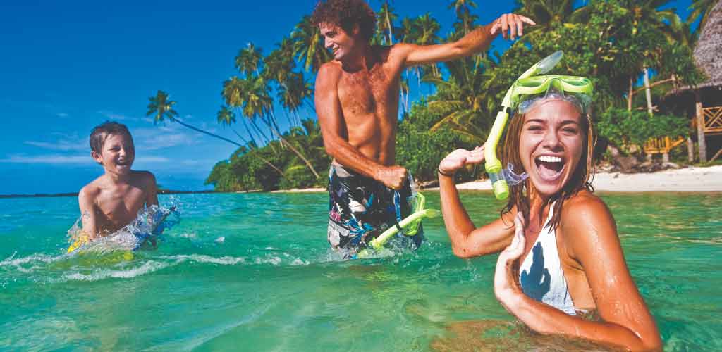 A family enjoying themselves off a beach in Samoa. 
